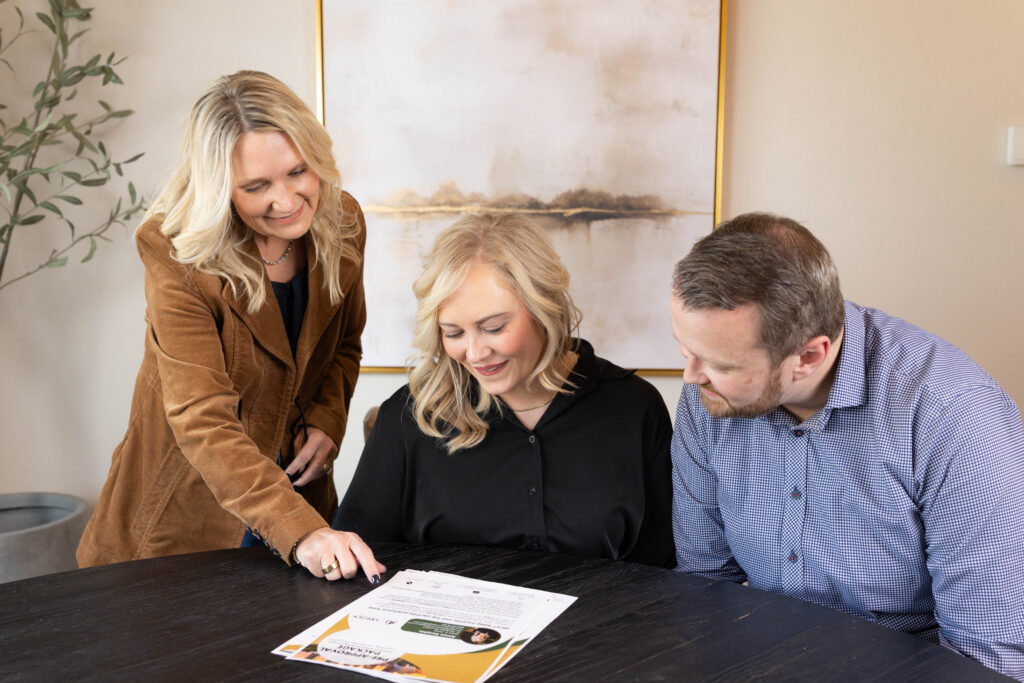 Mortgage specialists answering mortgage questions with mortgage education for first-time home buyers in Oklahoma during consultation